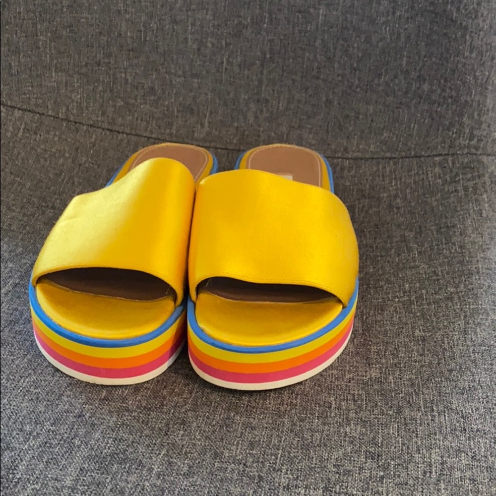 Tabitha Simmons yellow rainbow platform slides.